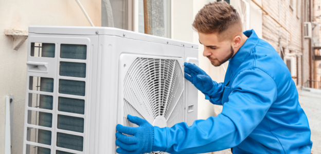 HVAC Technician installing air conditioner